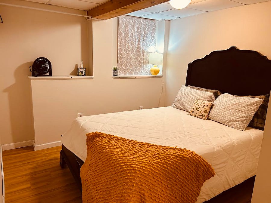Queen size bed with memory foam mattress and flannel sheets.