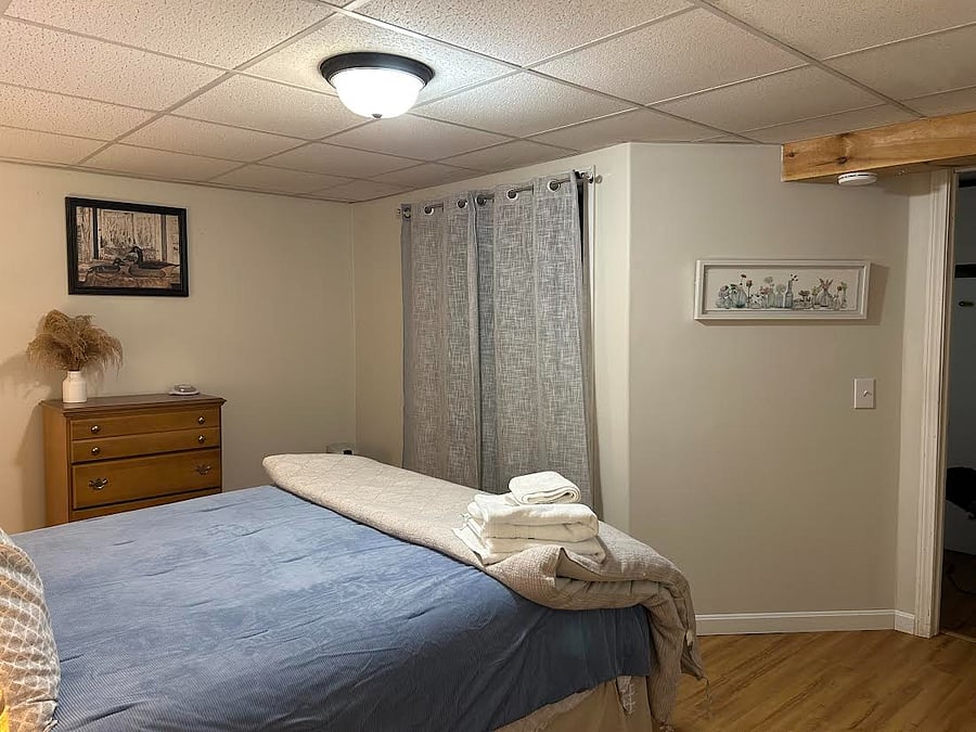 Bedroom #2: Queen size bed, dresser, portable heater, night stands w/ lamps and a walk-in closet (which currently holds a full size mattress w/ boxspring)