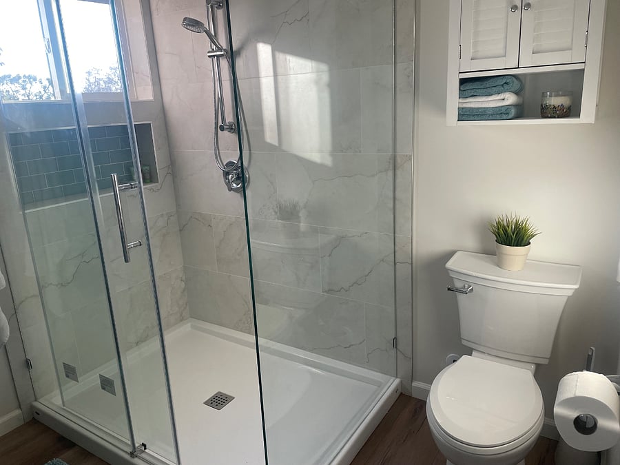 main bathroom, double vanity and walk in adjustable shower