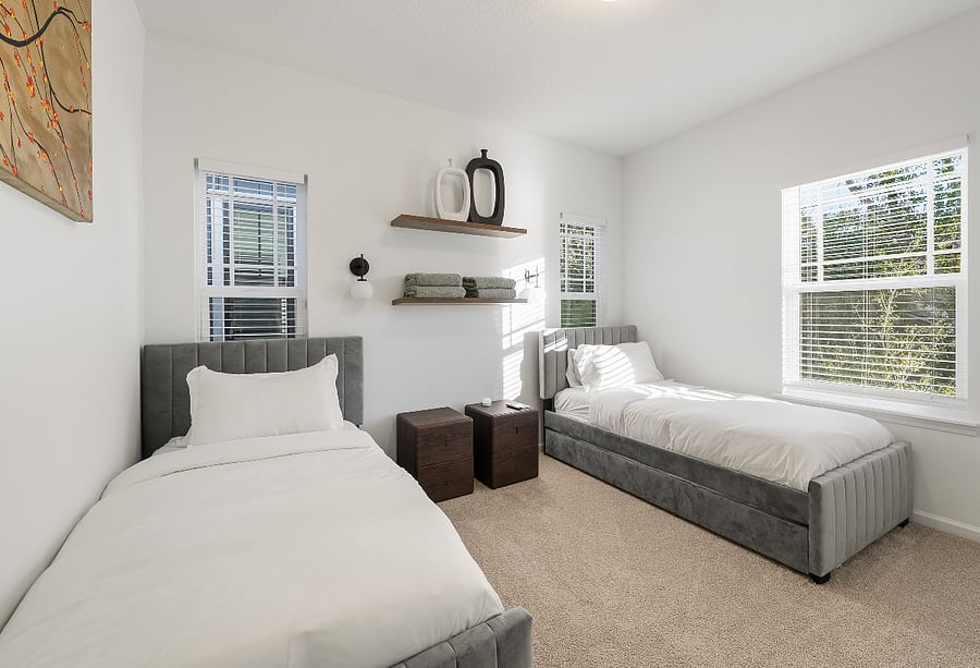 Guest Bedroom #2 with two twin trundle beds with 43" Smart TV in room. 