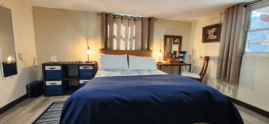 Queen Bed with Sheex Sheets and Down Alternative Blanket. Room Darkening Curtains. We can wash the sheets and towels weekly.