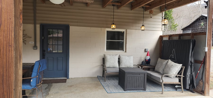 Lighted seating area to enjoy our weather rain or shine. There is an Outlet so if you need to work remotely you can actually do it right there.