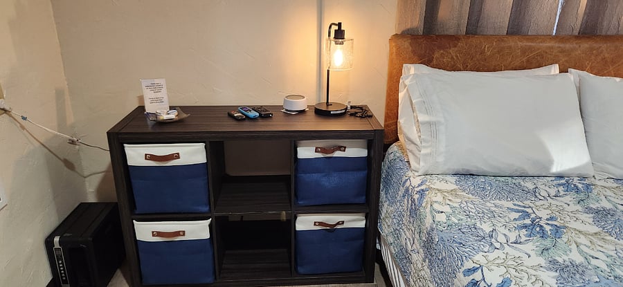 The light is touch activated with built in charging ports with chargers available. A Sound Machine can Lull you to Sleep, which you wont need as its so quiet here. There is also remotes for the TV and a Portable Heater. I have included a Complimentary Sample of my hand made Essential Oil Products.
