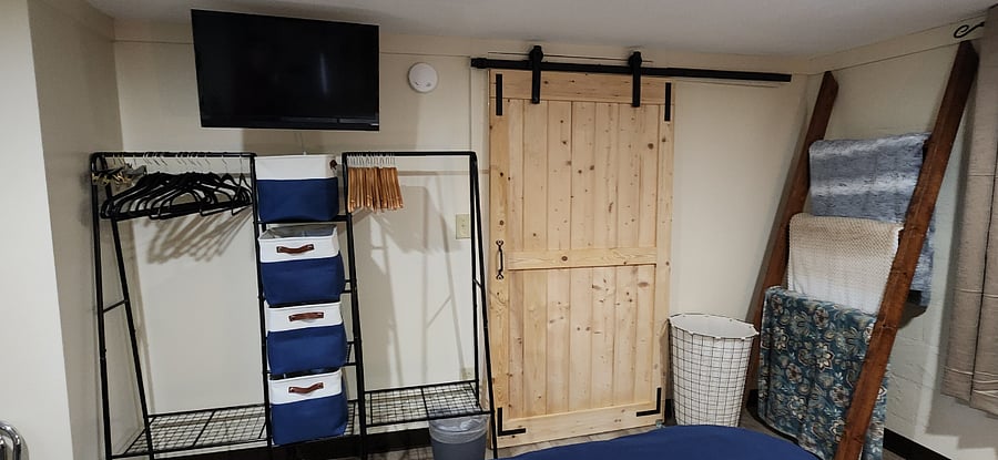 Lots of Storage for Clothing, with Wood and Pants Hangers available. Plenty of Bins for small items. There is a Roku enabled TV with YouTubeTv, Paramount and Prime Video channels included above the Closet Rack. Several Blankets for your comfort