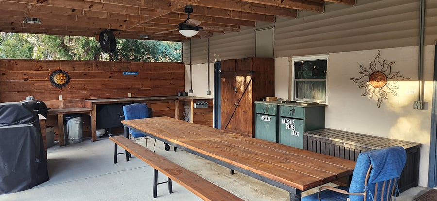 Eat outside on our Hand made table. Ceiling Fans to keep you Cool and Light the area