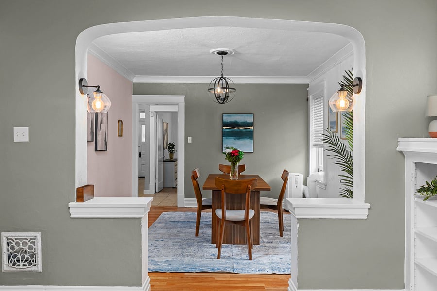 Classic St. Louis archway and hardwood floors add character while keeping the layout open and functional.F