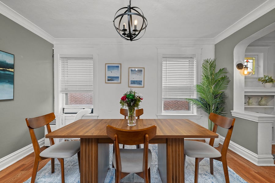 Bright dining room with natural light a comfortable space for meals, charting, or unwinding after shifts.
