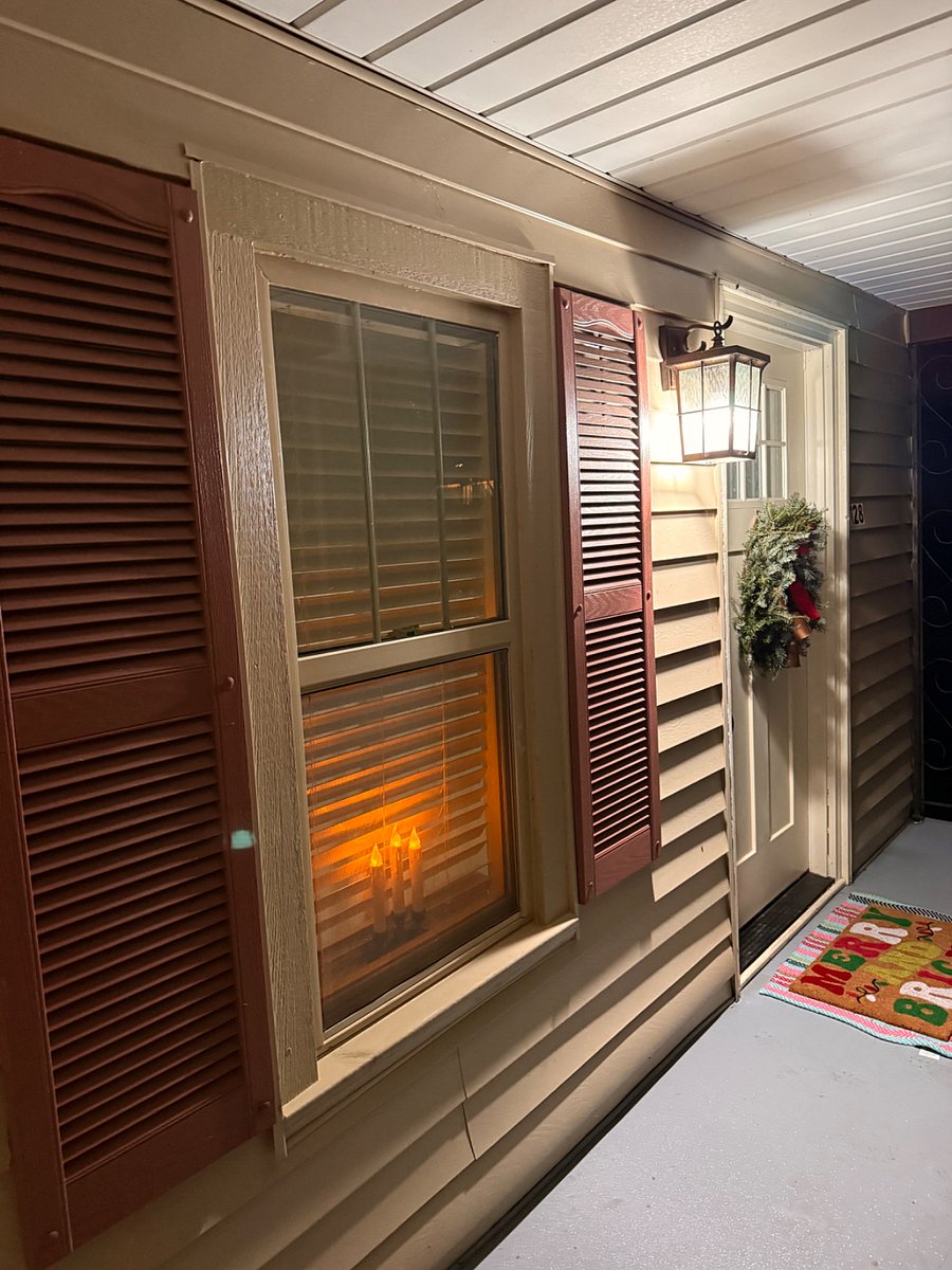 Covered front porch with two entries.