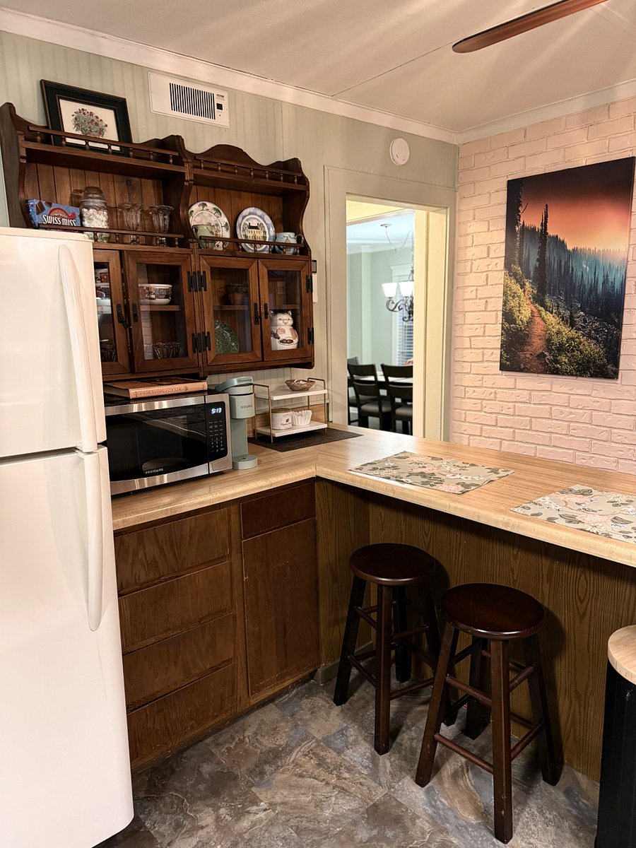 Kitchen bar features a microwave and Keurig coffee maker. Find some seasonal snacks nearby!