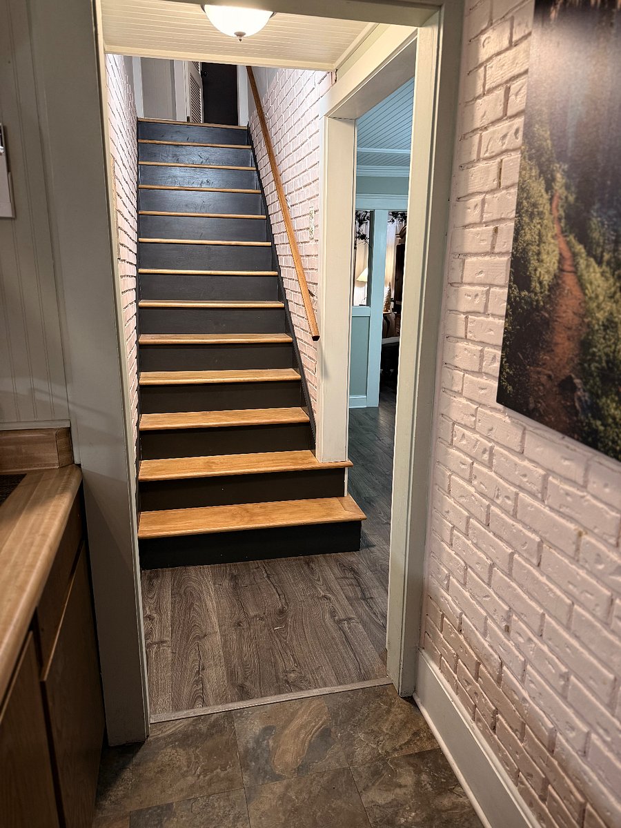 From the kitchen are the stairs, that take you to the other two bedrooms, and full bath with shower.