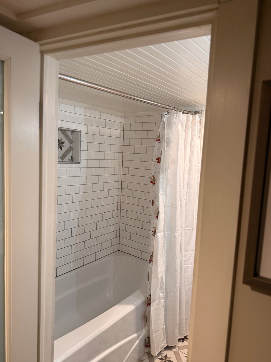 Upstairs tiled tub shower.