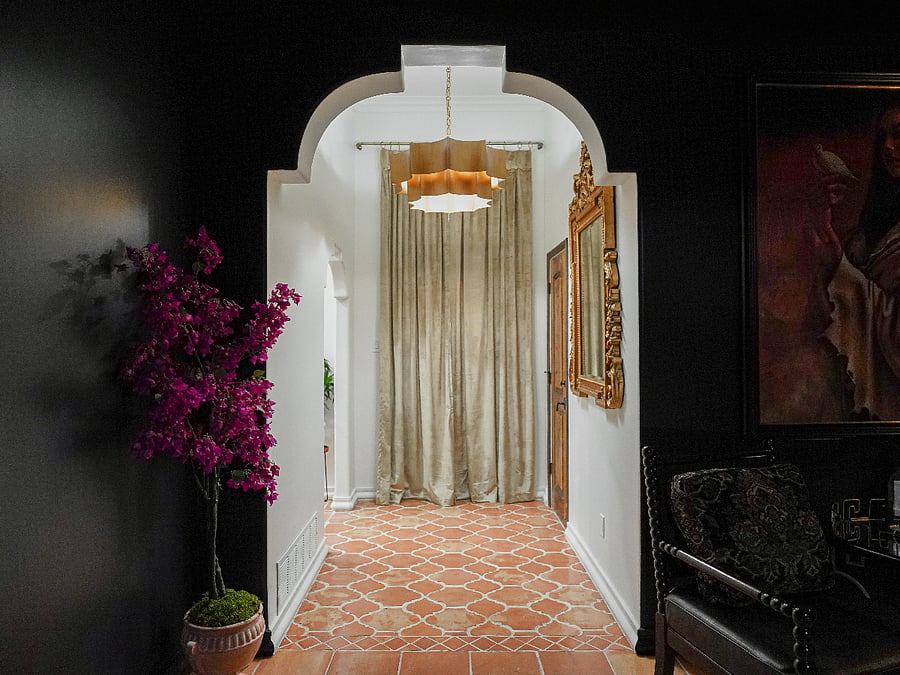 Spanish Arches and a gold ornate mirror with a fabulous dimming chandelier to welcome you as you walk into the entry way. 
