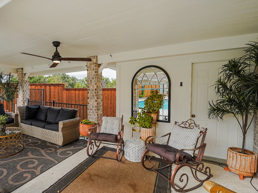 Savor the art of outdoor living on the shaded patio, Classic wicker couches with plush cushions and timeless rocking chairs invite effortless relaxation and intimate gatherings. These comfortable, enduring piecescrafted for supreme comfort and sophisticated ranch elegancecreate the perfect vantage for enjoying the rustle of mature trees, the gentle murmur of fountains, and the vast Texas sky.
As dusk falls, the sparkling pool transforms into an enchanting glow, illuminated by vibrant fluorescent lights that dance across the water alongside the soothing integrated fountainperfect for refreshing evening dips in a mesmerizing, colorful ambiance.
This private, secluded oasisembraced by an 8-foot stained cedar fenceblends tranquil indulgence with luxurious comfort, day or night.
Imagine claiming these magical moments for your mid-term retreat...
