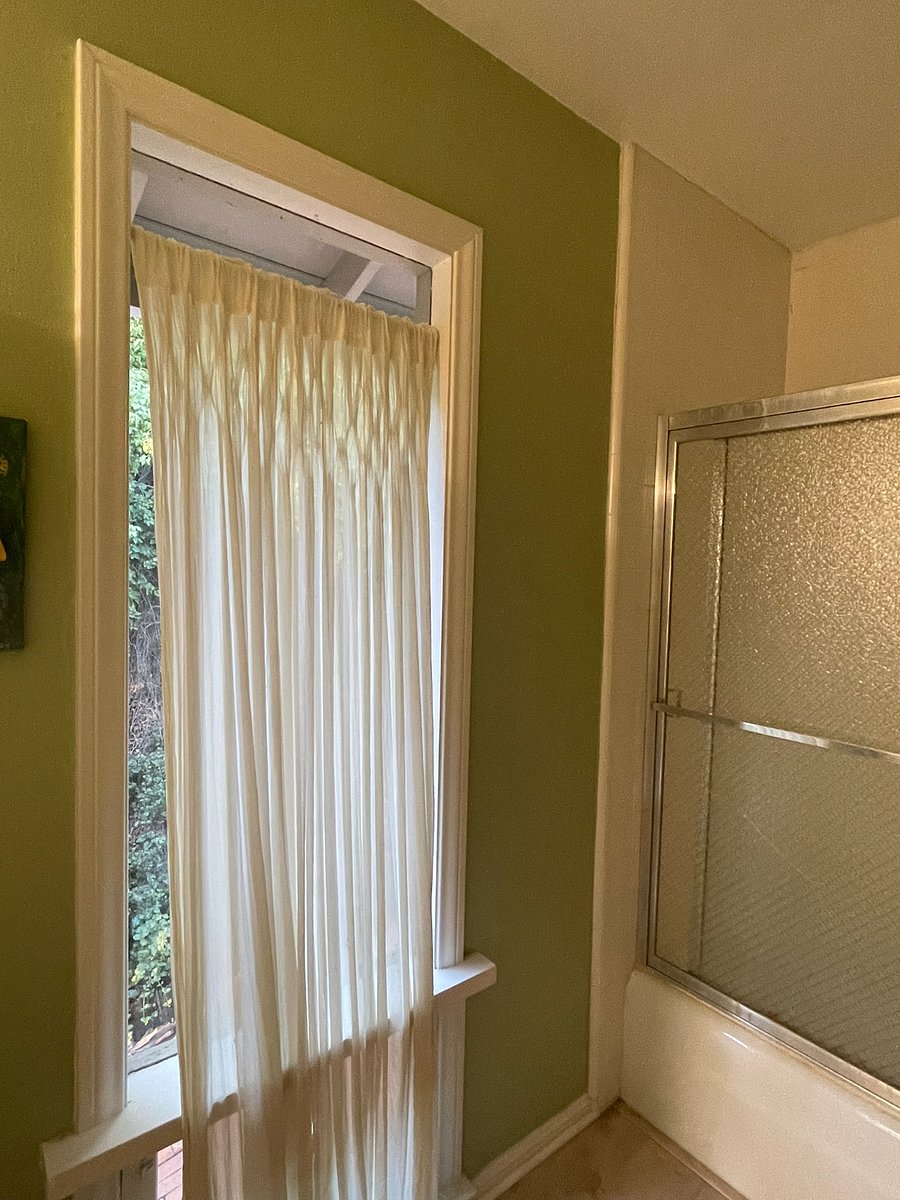 Very private--a wooded hill outside window of the bathroom