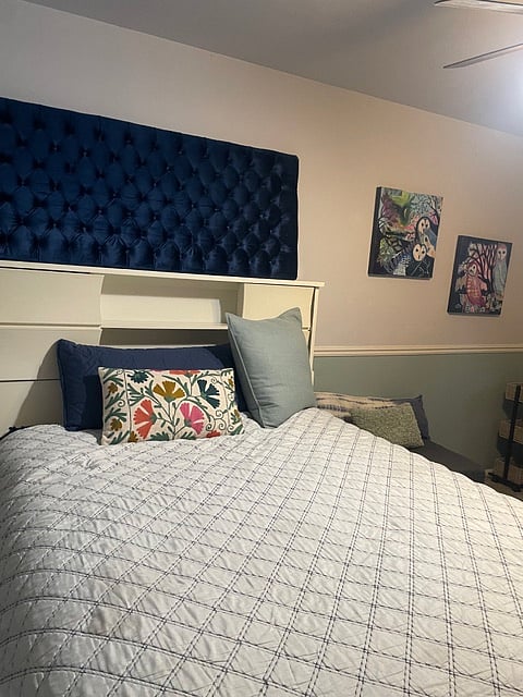 To the right of the bed is a chair for reading, a desk that looks out the sliding doors and the patio.