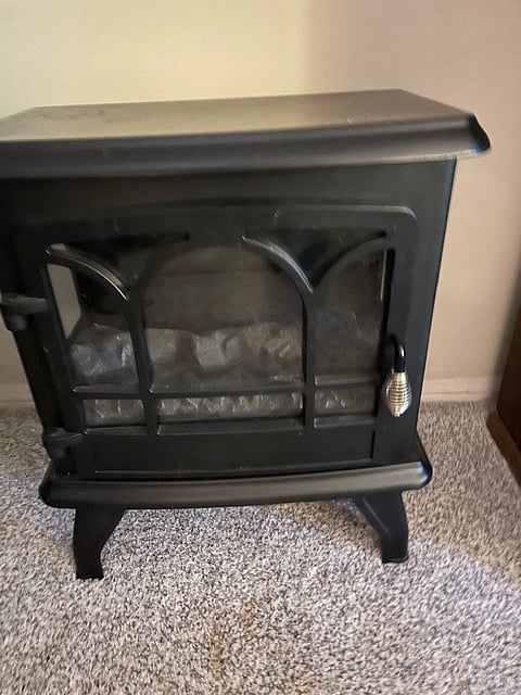Bedroom two portable fireplace. We call this room the Cassatt Room.Bedroom two