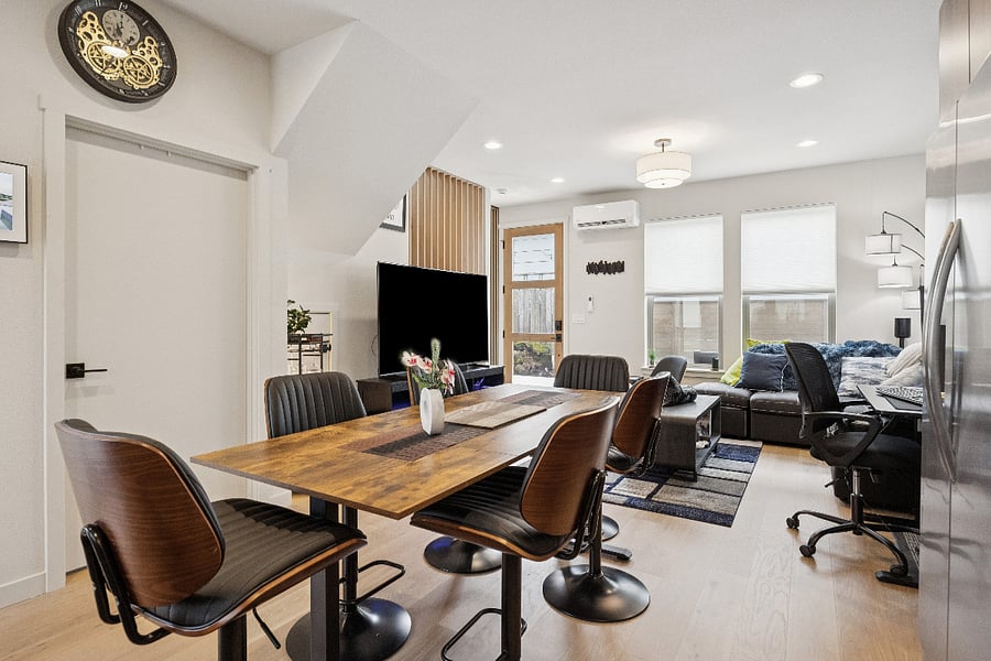 Dining room table is built on a stand up desk. Adjustable form table height