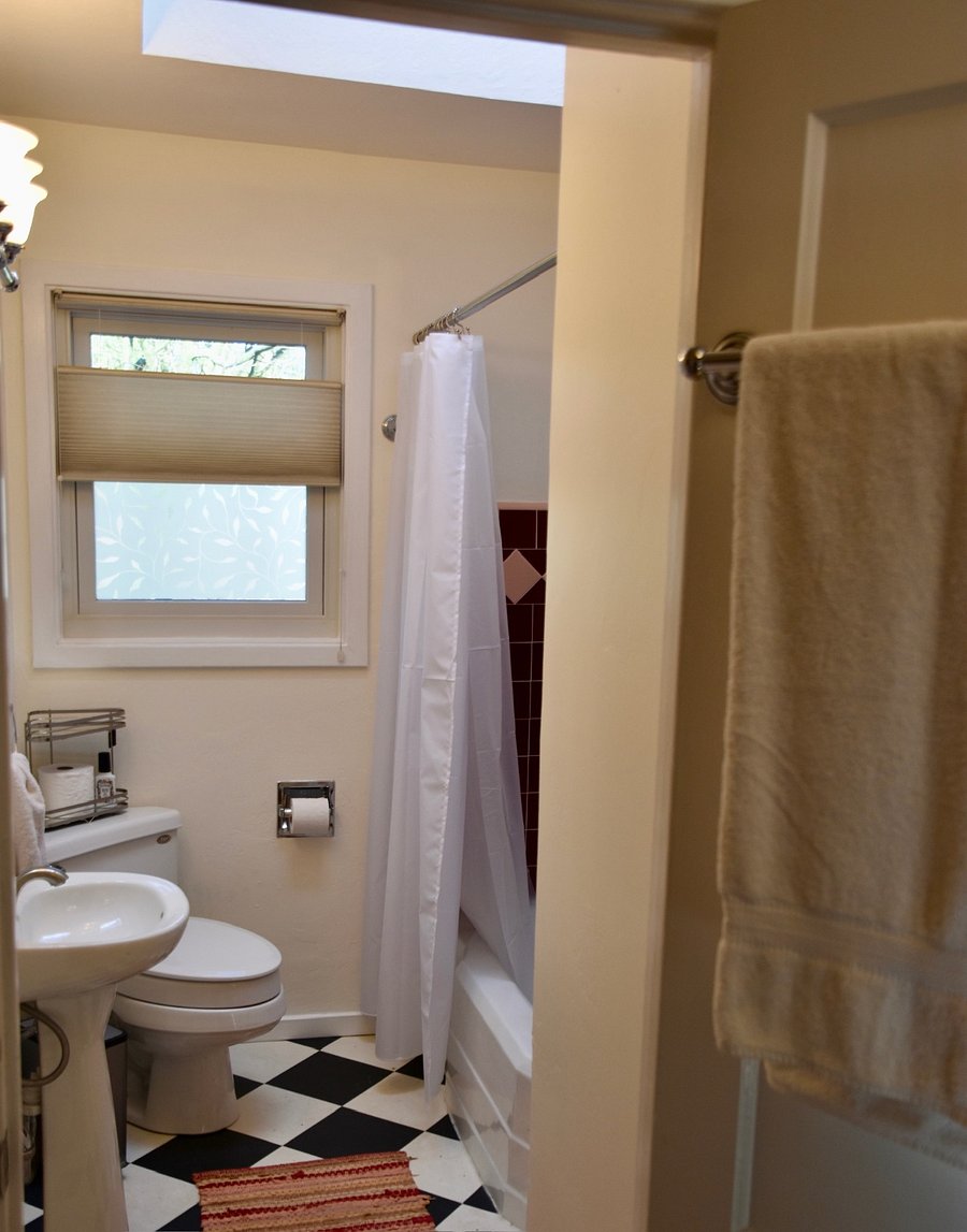 Bathroom with shower over tub