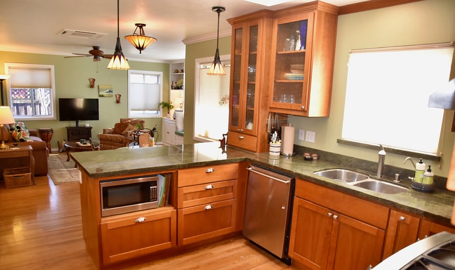 Kitchen looking into dining area and living room