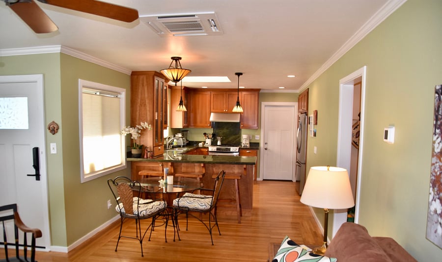 View from living room into kitchen and door to the single car garage