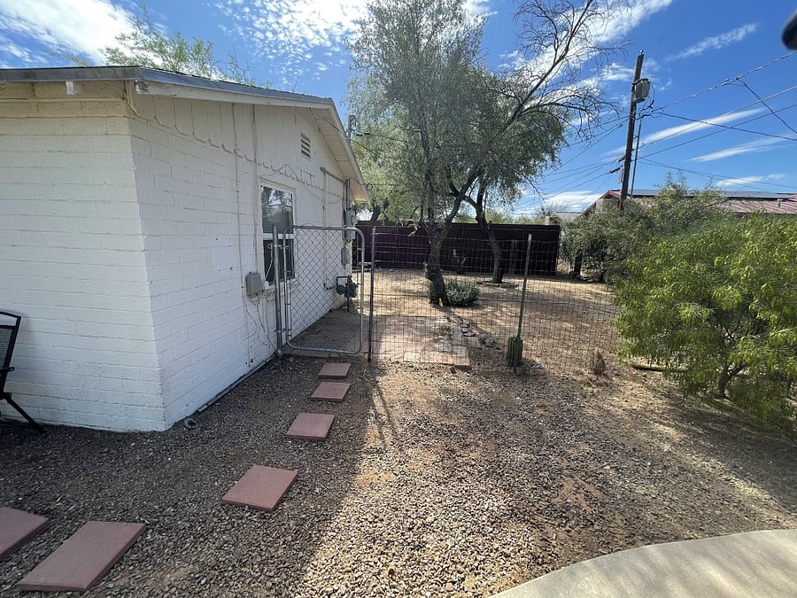 View of backyard from basketball court