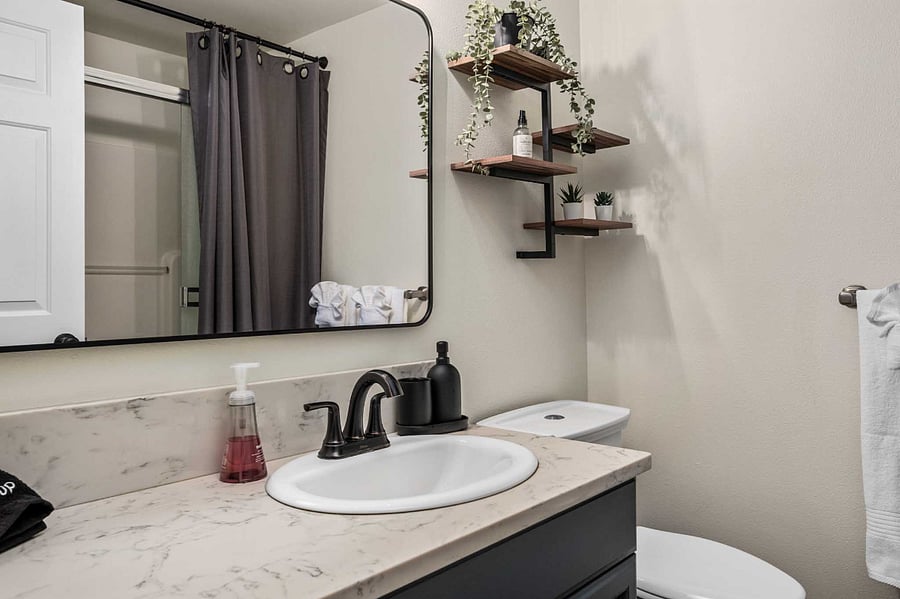 The primary bedroom has an attached bathroom with shower. The home features a tankless water heater that provides hot water on demand.