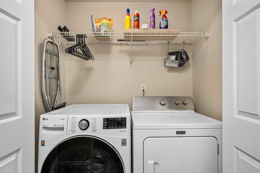 Dedicated laundry area with full-size washer and dryer for added convenience during longer stays.