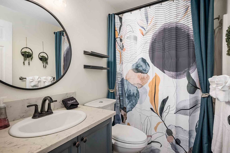Guest bathroom with a bathtub. Our tankless water heater ensures continuous hot water for showers and daily use.