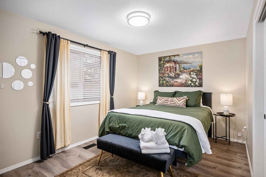 A cozy bedroom with a queen bed, perfect for rest and relaxation.