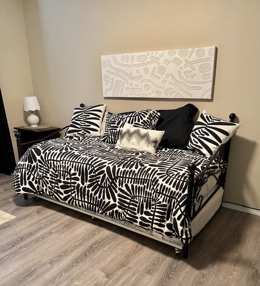 The middle bedroom includes a twin trundle bed and a small pull-out couch.