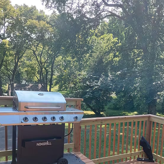 Back deck and private backyard, perfect for relaxing or outdoor gatherings