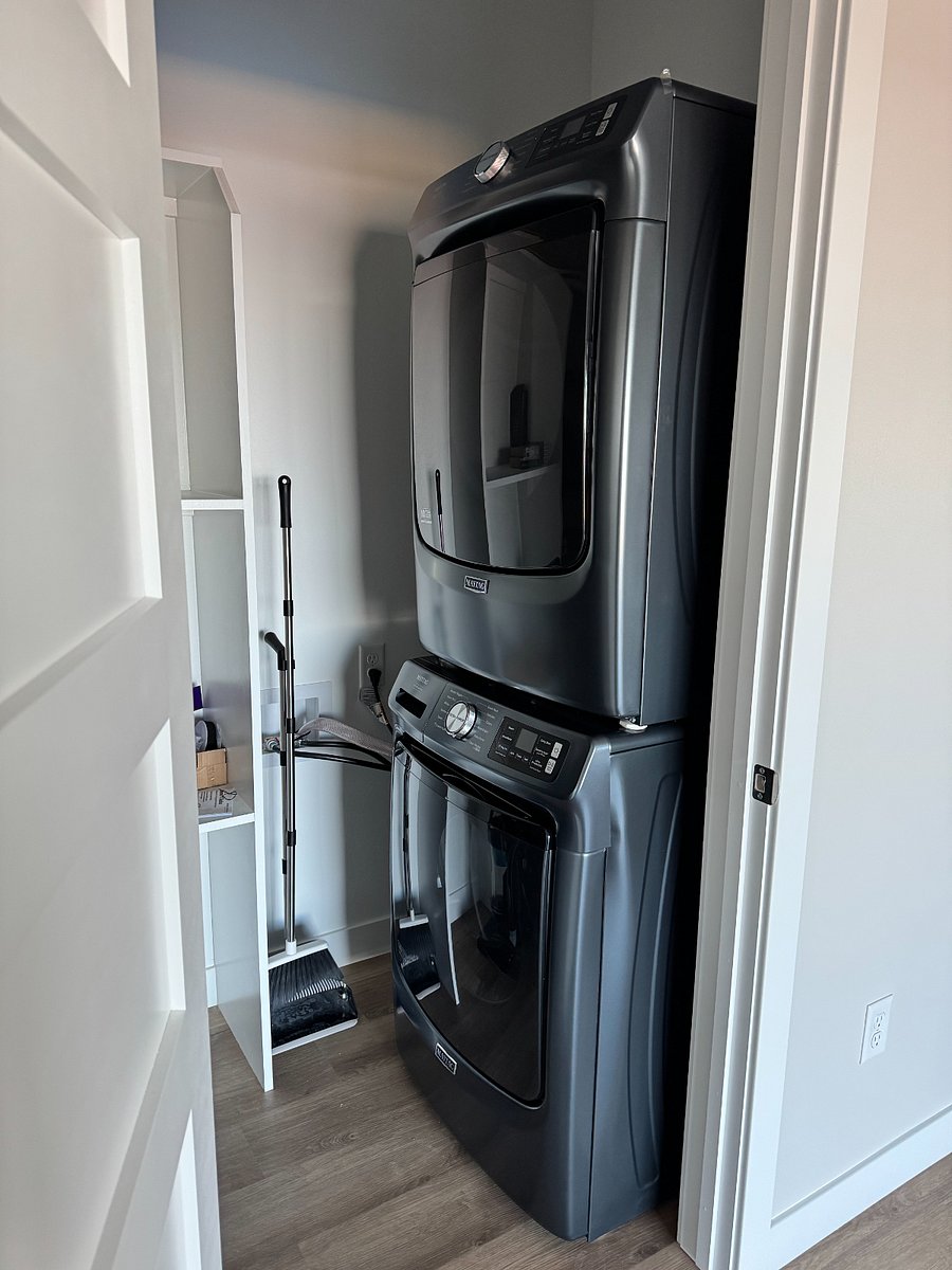 Upper Level washer and Dryer, same washer and Dryer combo on all three levels.