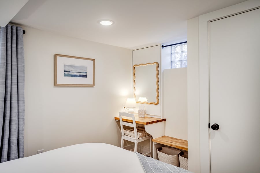 Desk/vanity space with outlet.