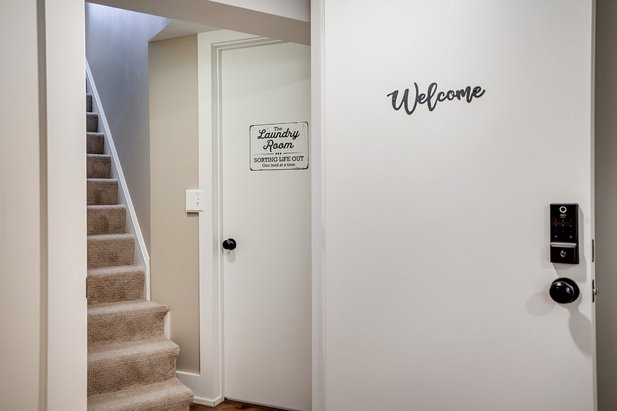 The well-insulated laundry room is conveniently located adjacent to the guest space.