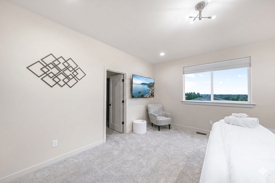 Large 65 inch 4K TV in master bedroom