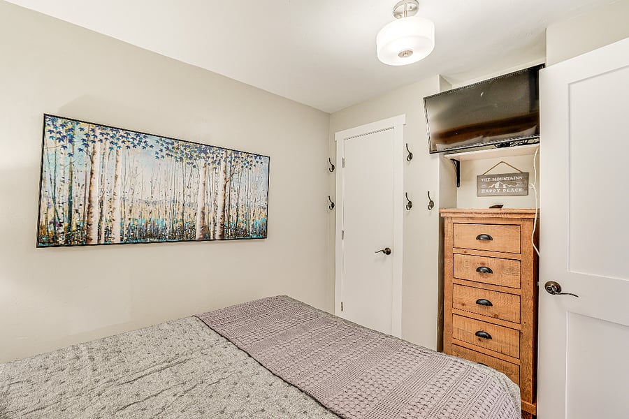 Bedroom - closet, dresser and smart TV