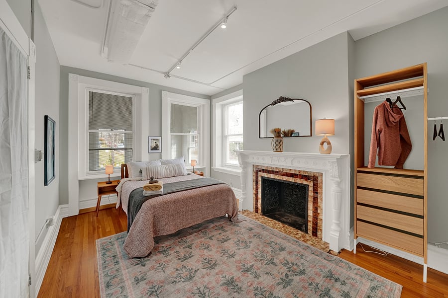 Very comfy bedroom with queen bed, plush rug and French doors. (fireplace is decorative only)