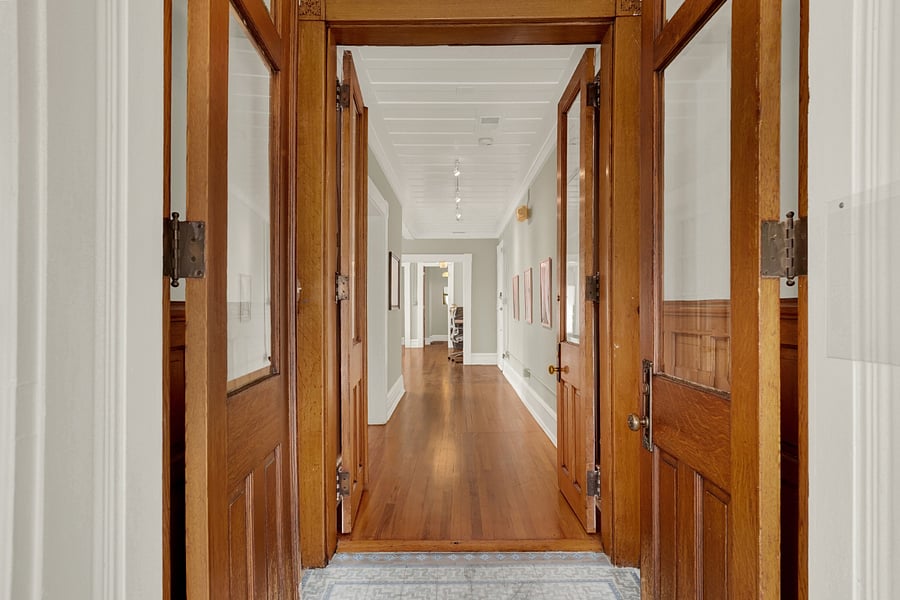 Unbelievable craftsmanship with towering double doors, wainscoting and gorgeous trim.