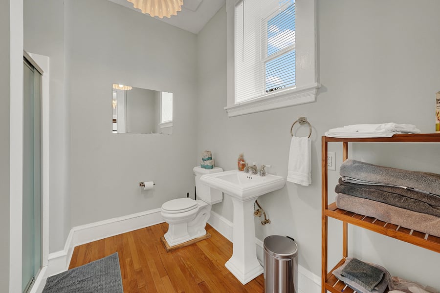 Step in shower with waterfall showerhead/handheld sprayer combo. Pedestal sink and all the necessities for your stay: towels, toiletries, hair dryer, iron.