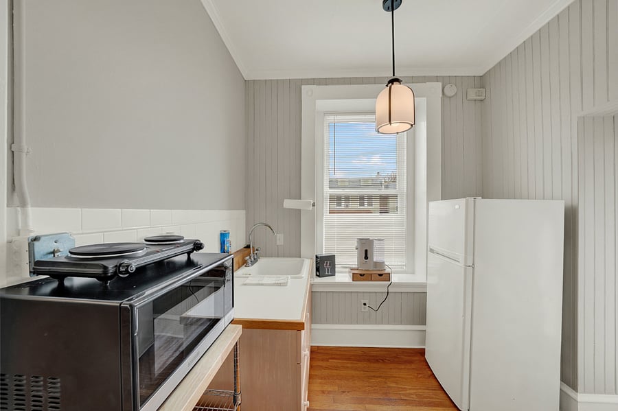 Kitchenette has everything to make basic meals: Dual electric hot plate with pots and pans, microwave, air fryer, toaster, and all kitchen ware.
