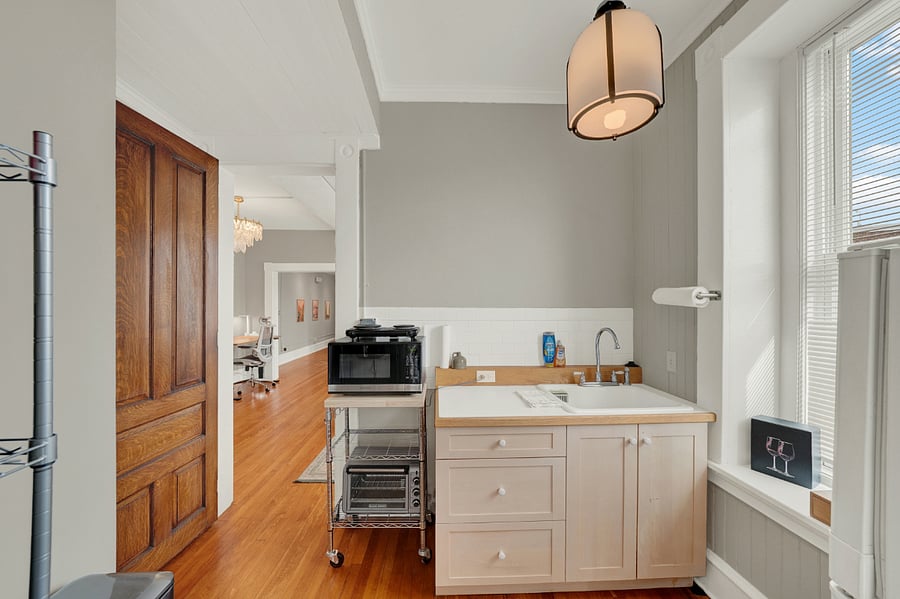 Kitchenette has everything to make basic meals: Dual electric hot plate with pots and pans, microwave, air fryer, toaster, and all kitchen ware.