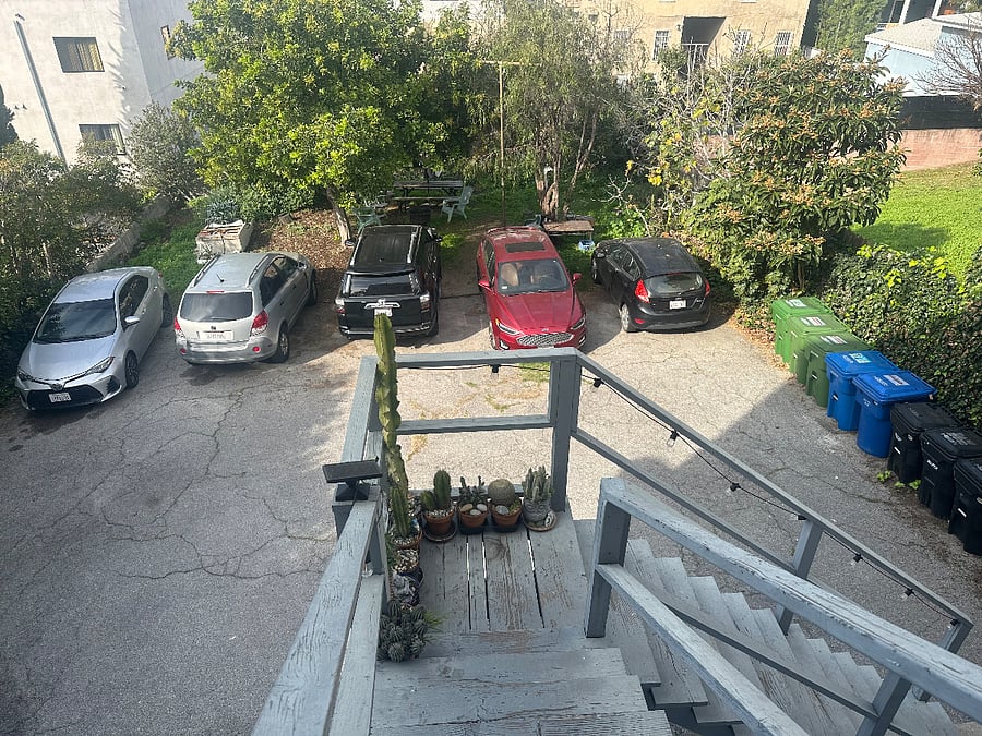 Large shared backyard with picnic table and garden. Dedicated uncovered parking spot. Back steps with easy access from parking to the apartment.