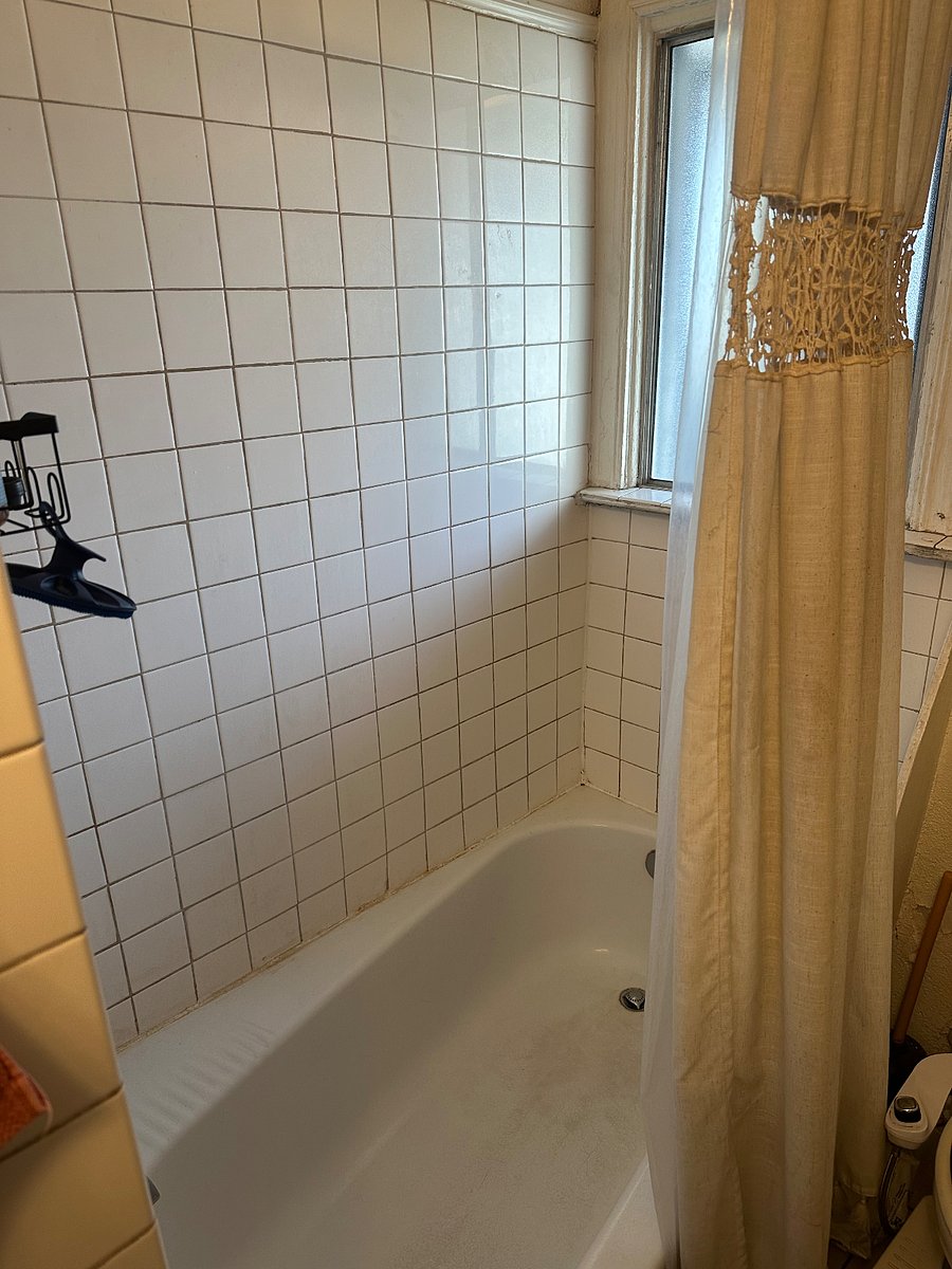 Shower and tub in shared bathroom.