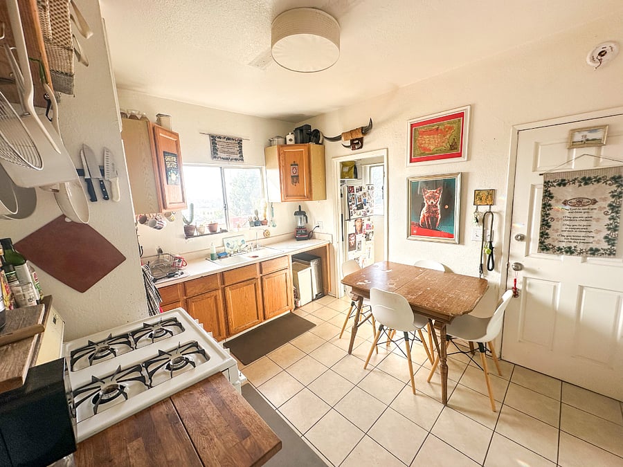 Fully equipped shared kitchen with dining area.