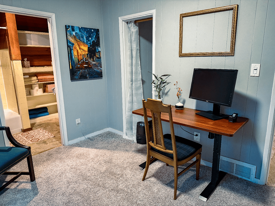 Dedicated work-from-home space with desk, monitor, and fast Wi-Fi.