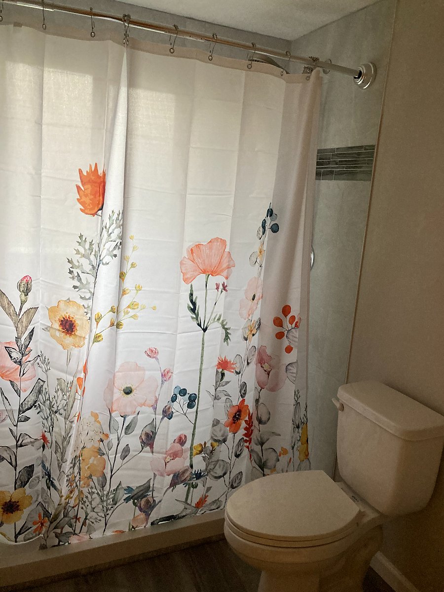 Full size tiled shower.