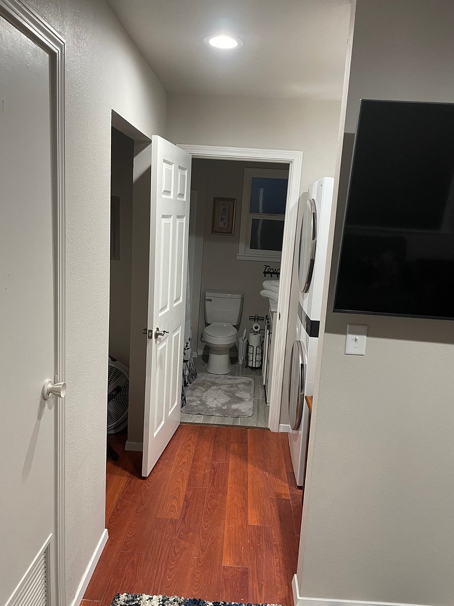 Hallway to bathroom past laundry