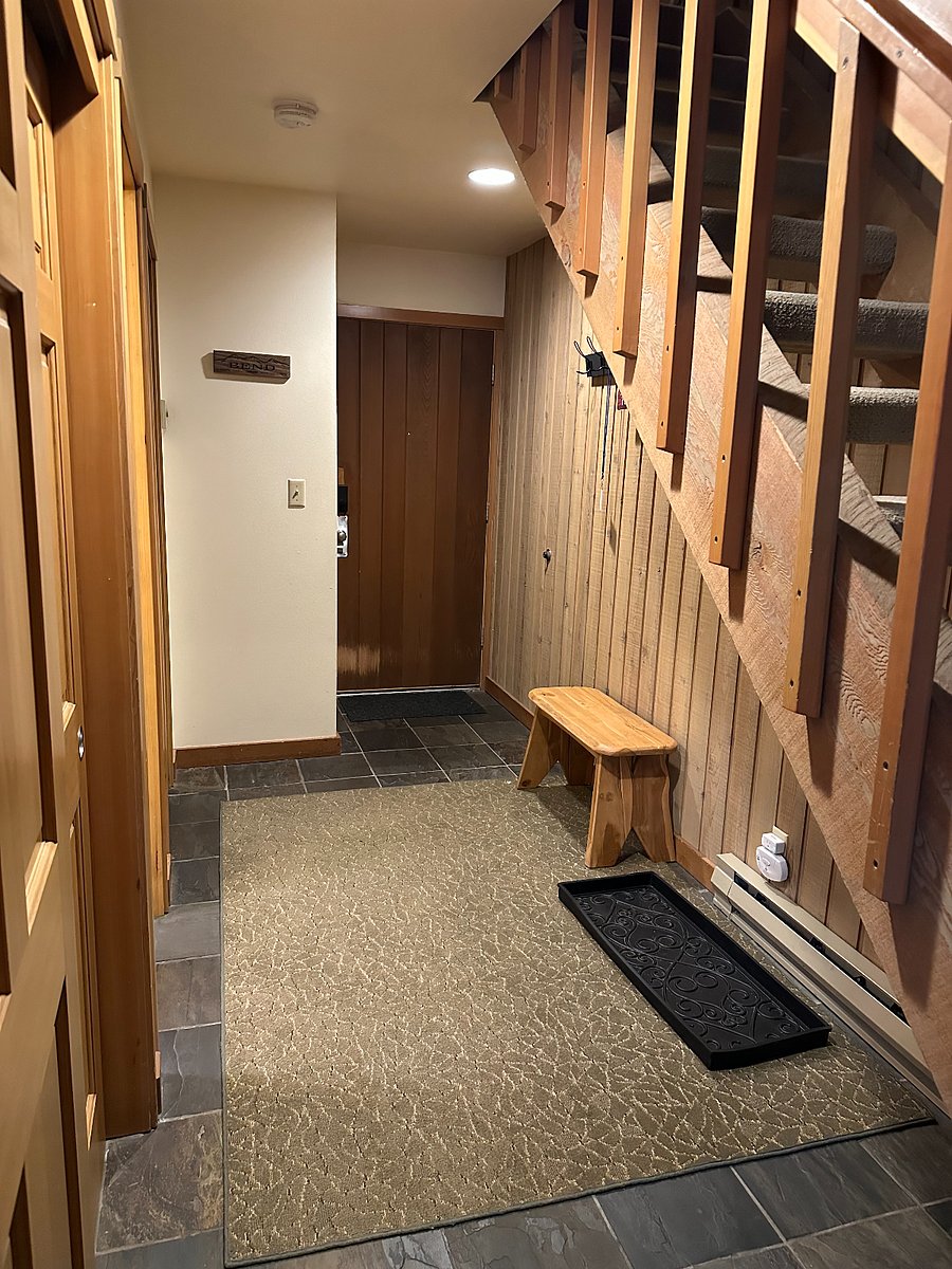 Entry way with place to hang coats and drop shoes.