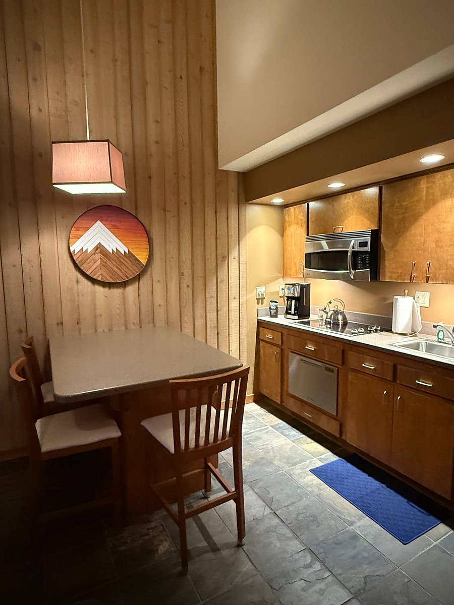 Kitchenette area. Dishwasher drawer, mid size refrigerator, full stove top and brand new microwave/convection oven. 