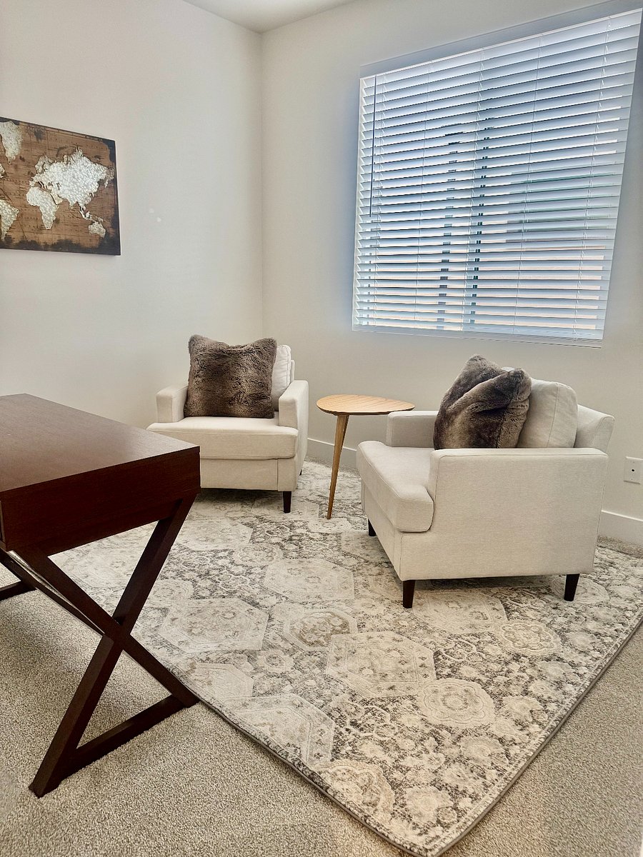 4th bedroom, set up as office with desk, office chair and two sitting chairs